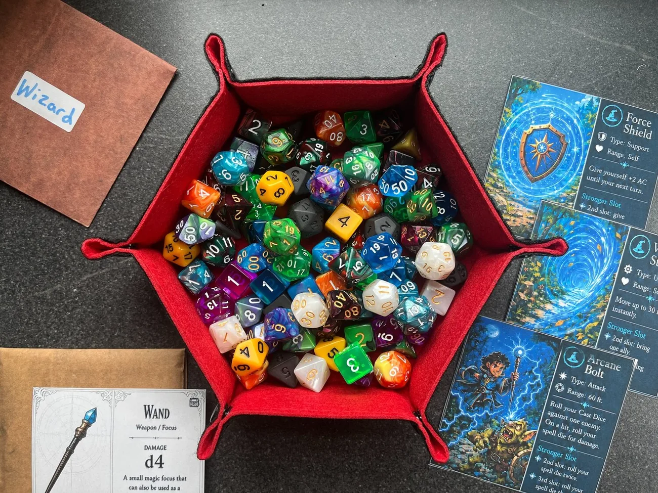 A red dice tray filled with colourful polyhedral dice beside The Hobbyist player resources
