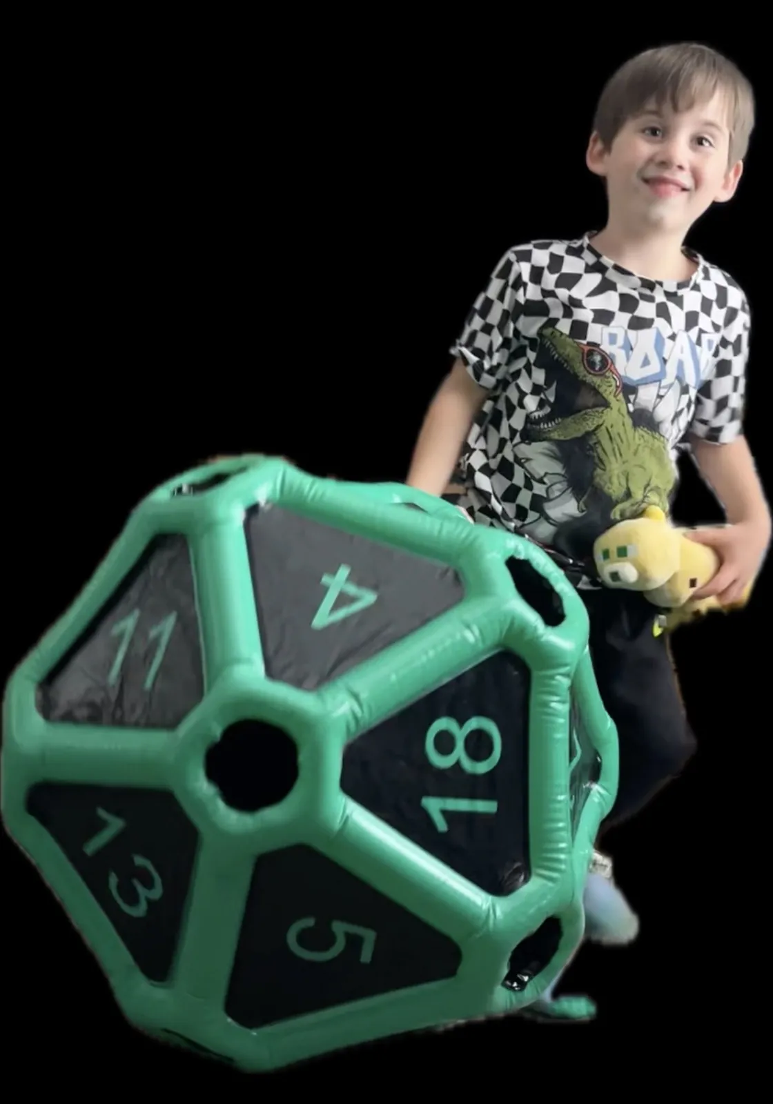 A young participant with a giant twenty-sided die, showing the playful side of tabletop adventures